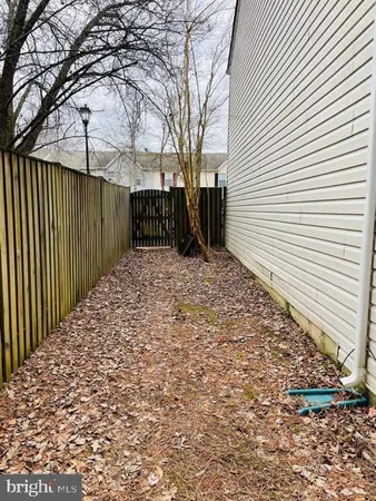 a view of a backyard of the house
