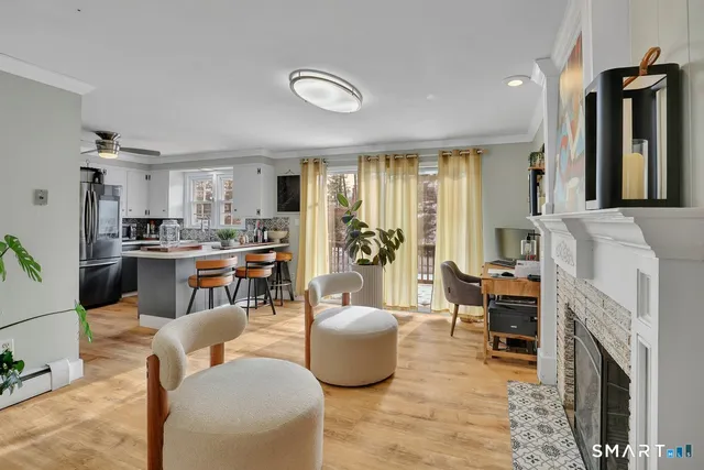 a living room with furniture and a fireplace