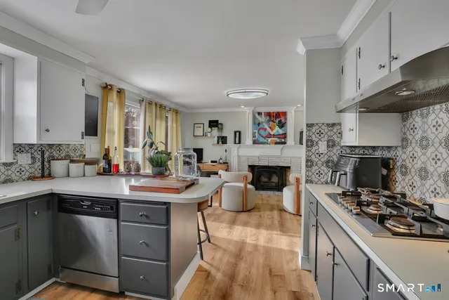 a kitchen with a sink stove and cabinets
