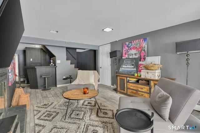 a room with furniture and wooden floor