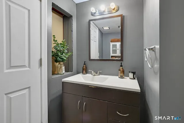 a bathroom with a sink and a mirror