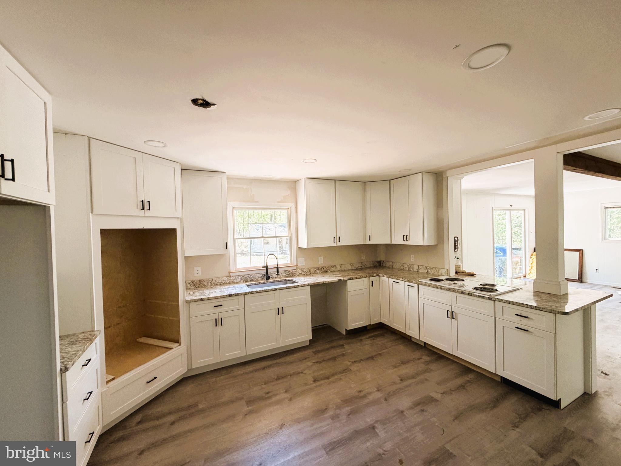 25865 Brookwood Road Greensboro, MD 21639 - Photo 11 of 18 a kitchen with a sink stove and cabinets