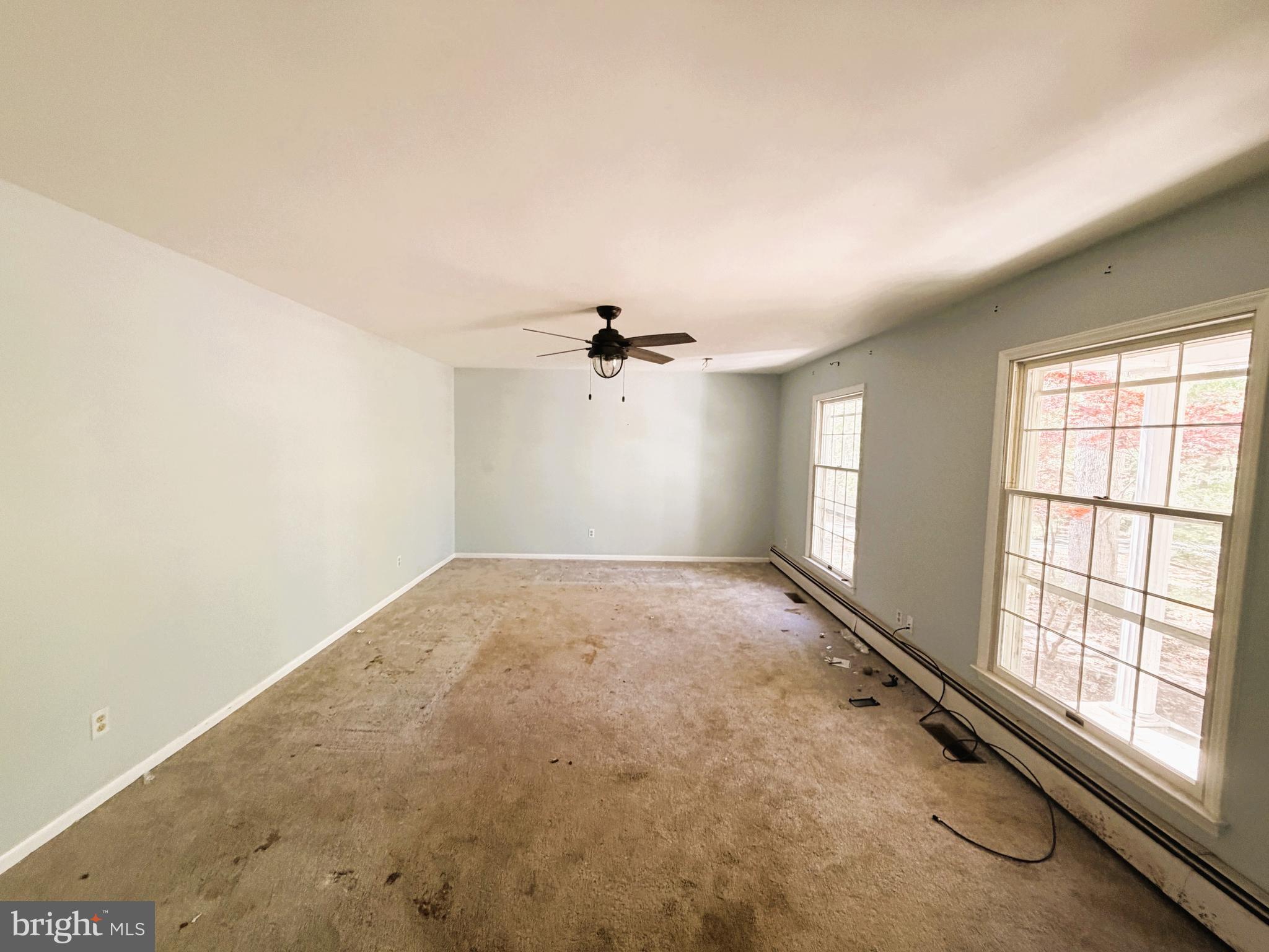 25865 Brookwood Road Greensboro, MD 21639 - Photo 14 of 18 an empty room with windows and ceiling fan view