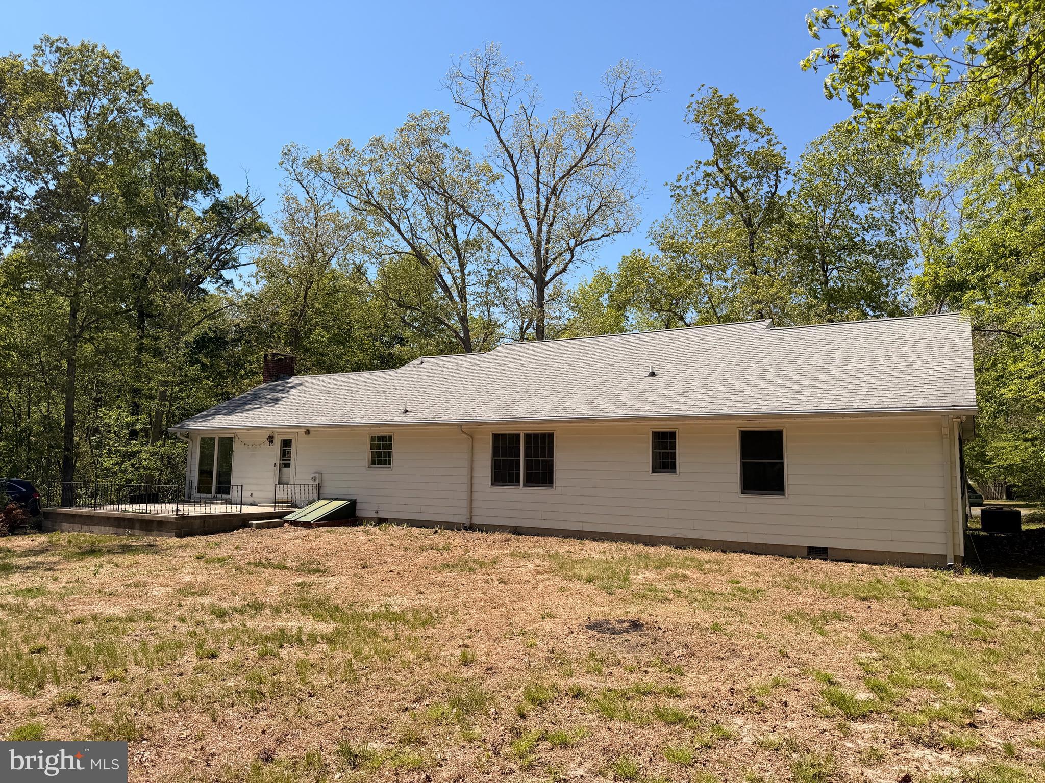 25865 Brookwood Road Greensboro, MD 21639 - Photo 4 of 18 a front view of house with yard and trees around