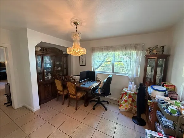 a view of a livingroom with furniture and a window