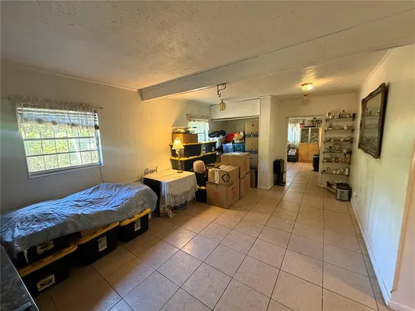 a bedroom with furniture and a window