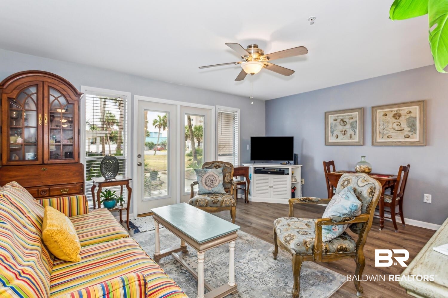 13551 Johnson Beach Road, Unit 112E Pensacola, FL 32507 - Photo 6 of 42 Living room with dark wood-type flooring and ceiling fan