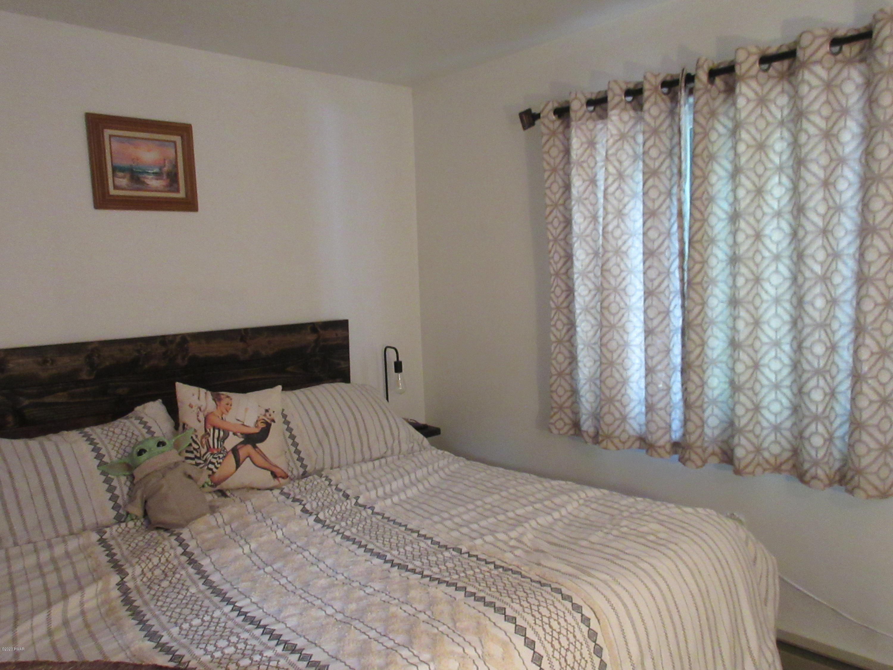 412 Maple Ridge Drive Hawley, PA 18428 - Photo 29 of 108 Master bedroom