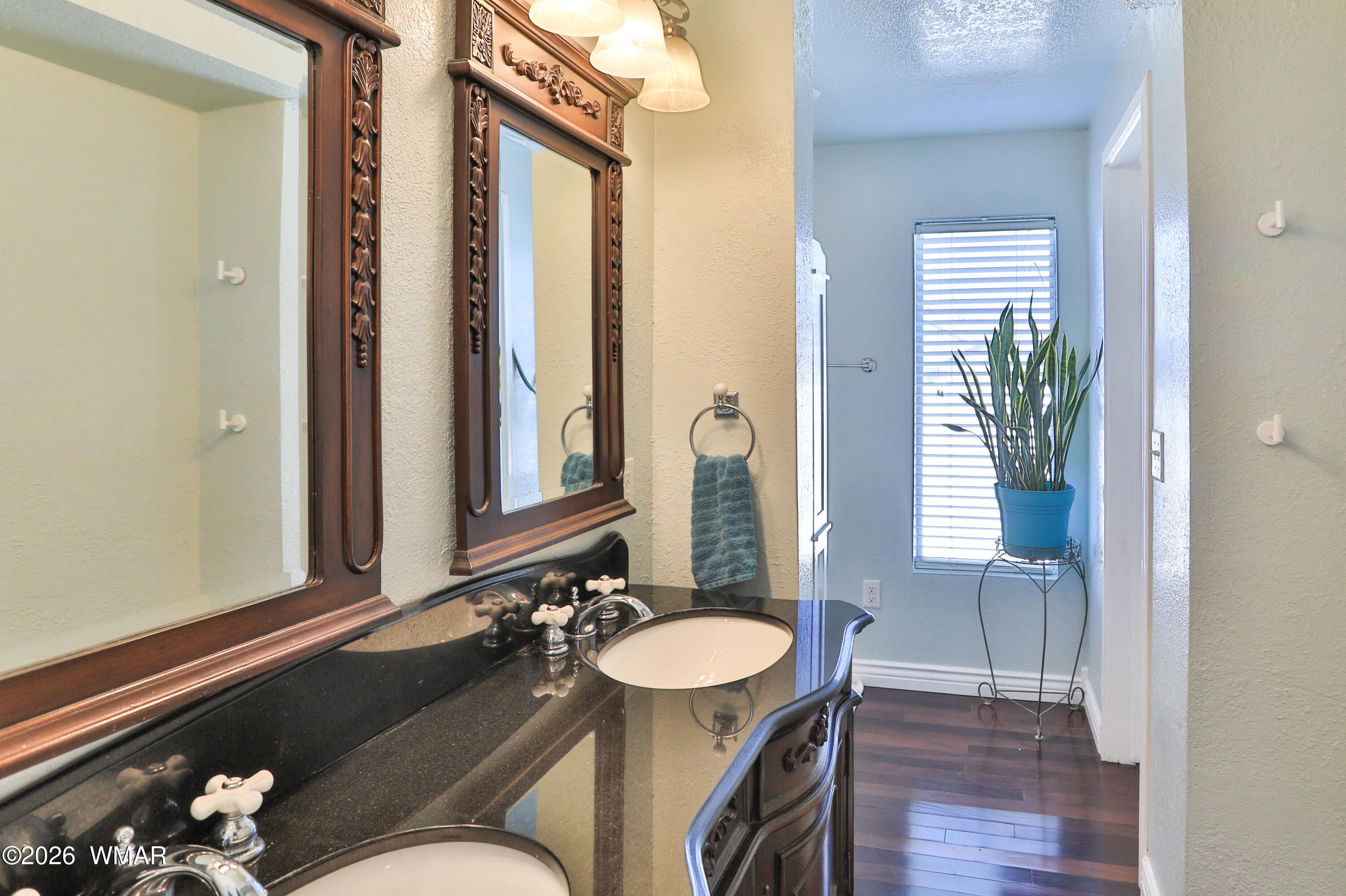 102 Crestview Road Holbrook, AZ 86025 - Photo 26 of 55 a bathroom with a sink and a mirror