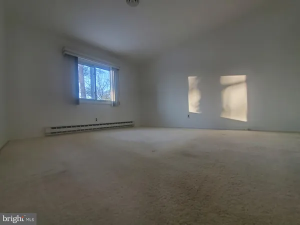 a view of a room that has a window in it