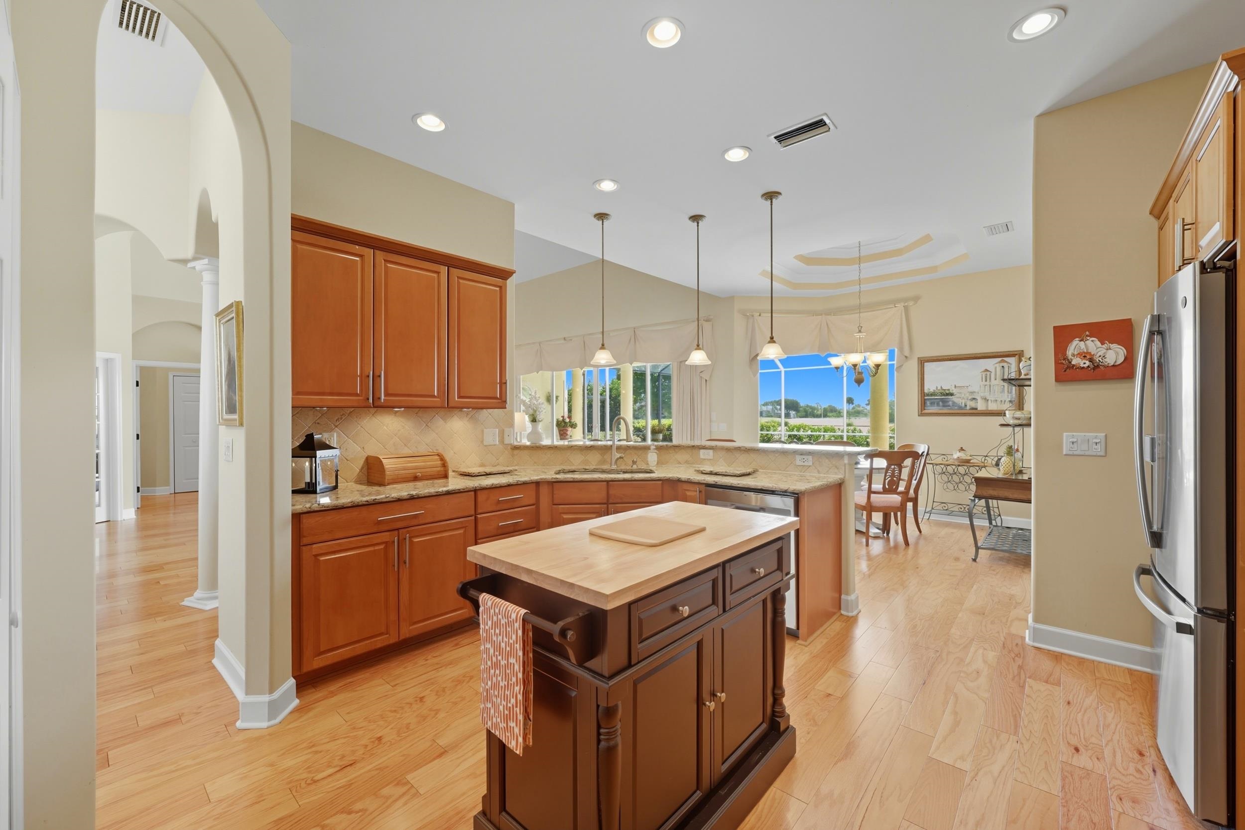 305 Marsh Point Circle St. Augustine, FL 32080 - Photo 17 of 82 a kitchen with stainless steel appliances granite countertop a stove and a refrigerator