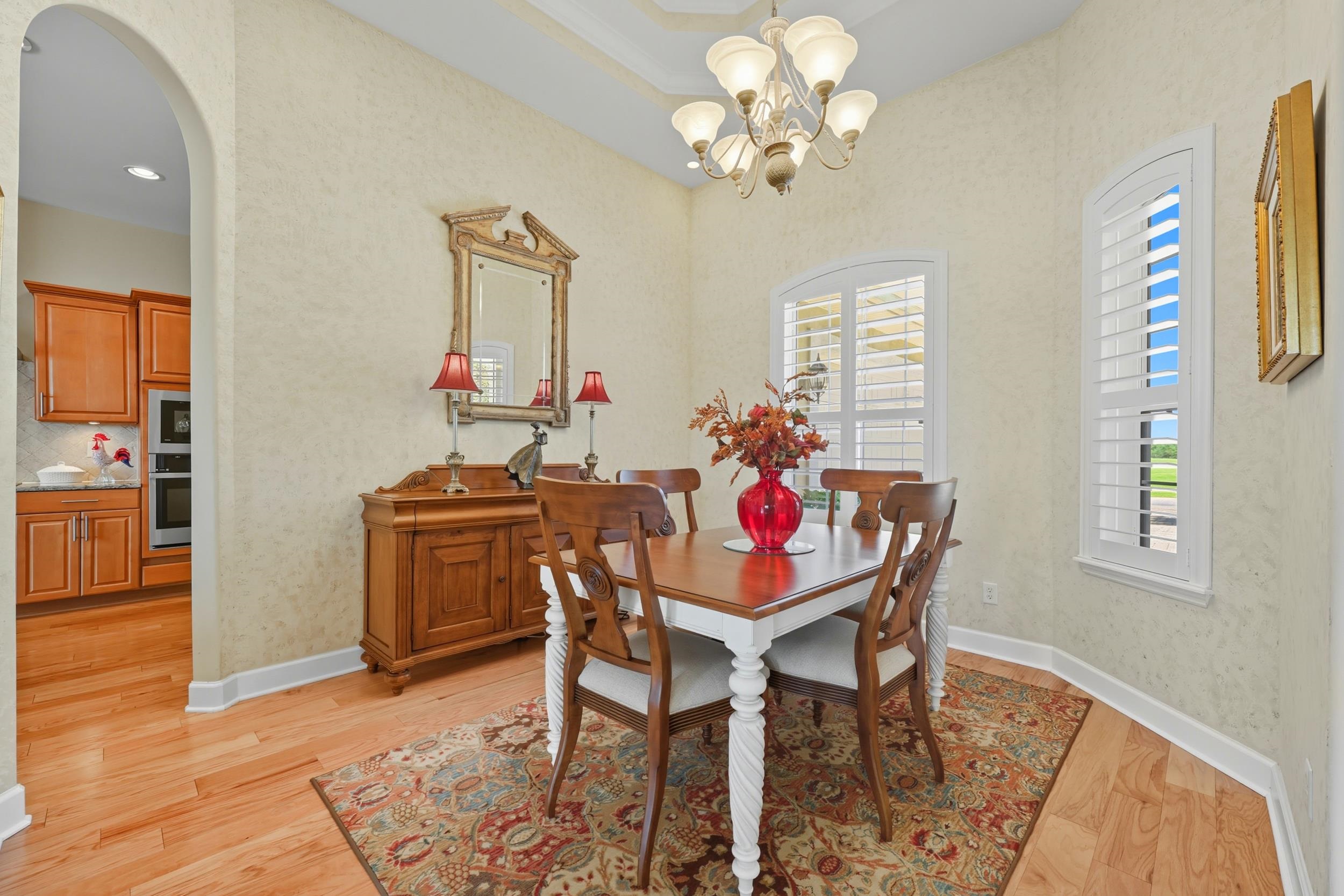 305 Marsh Point Circle St. Augustine, FL 32080 - Photo 21 of 82 a view of a dining room with furniture and chandelier