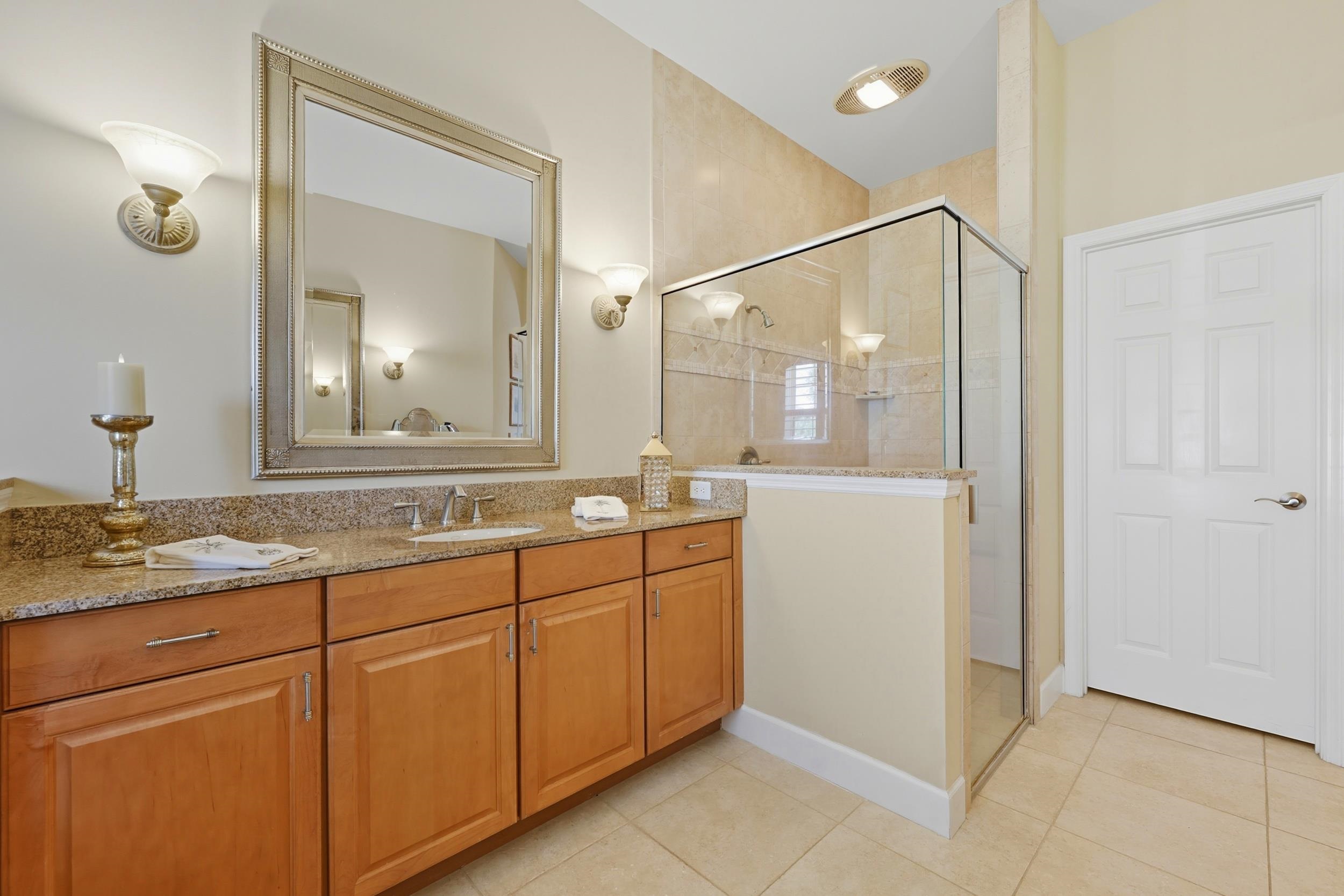 305 Marsh Point Circle St. Augustine, FL 32080 - Photo 29 of 82 a bathroom with a granite countertop sink mirror and double