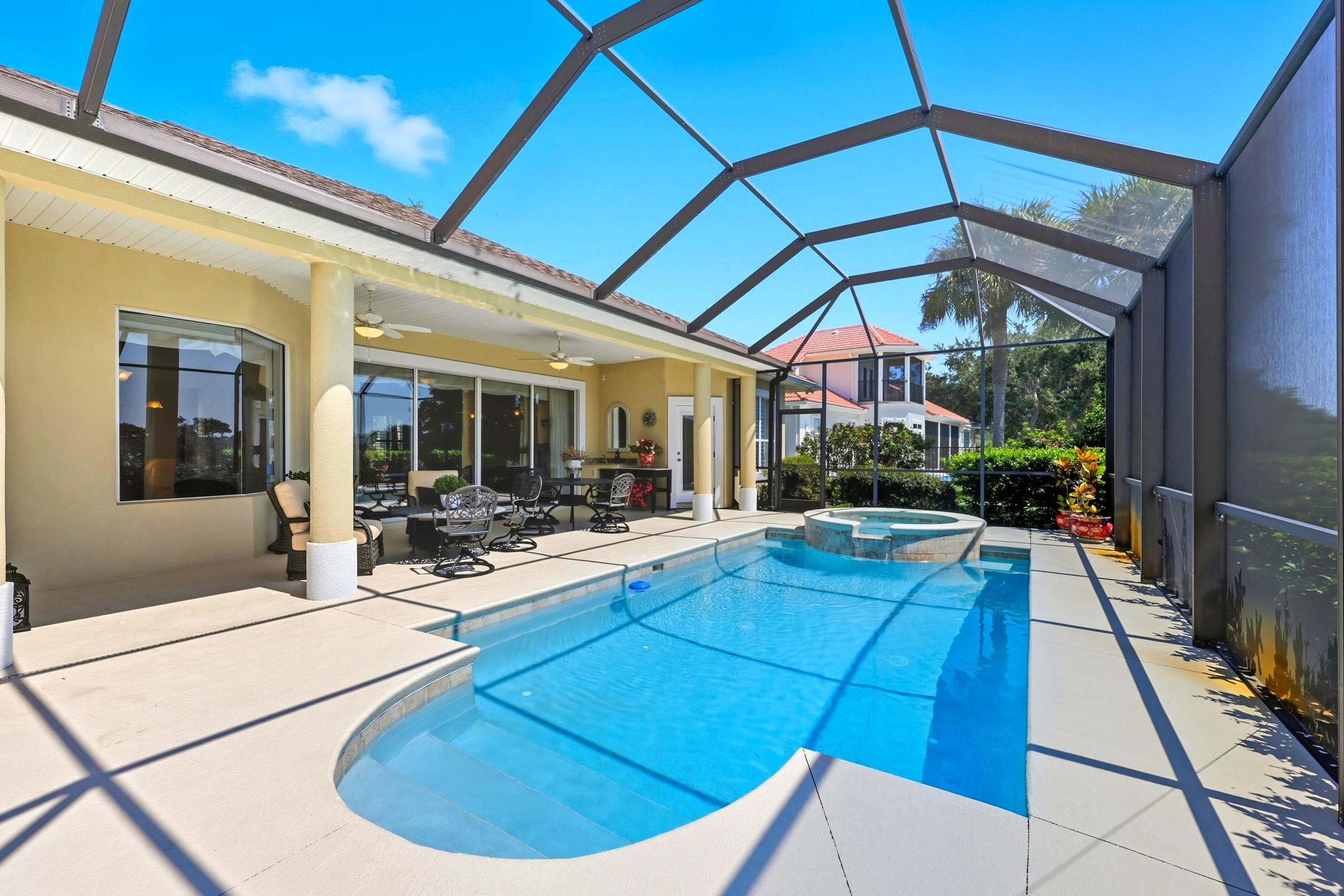 305 Marsh Point Circle St. Augustine, FL 32080 - Photo 47 of 82 a view of a patio with table and chairs under an umbrella