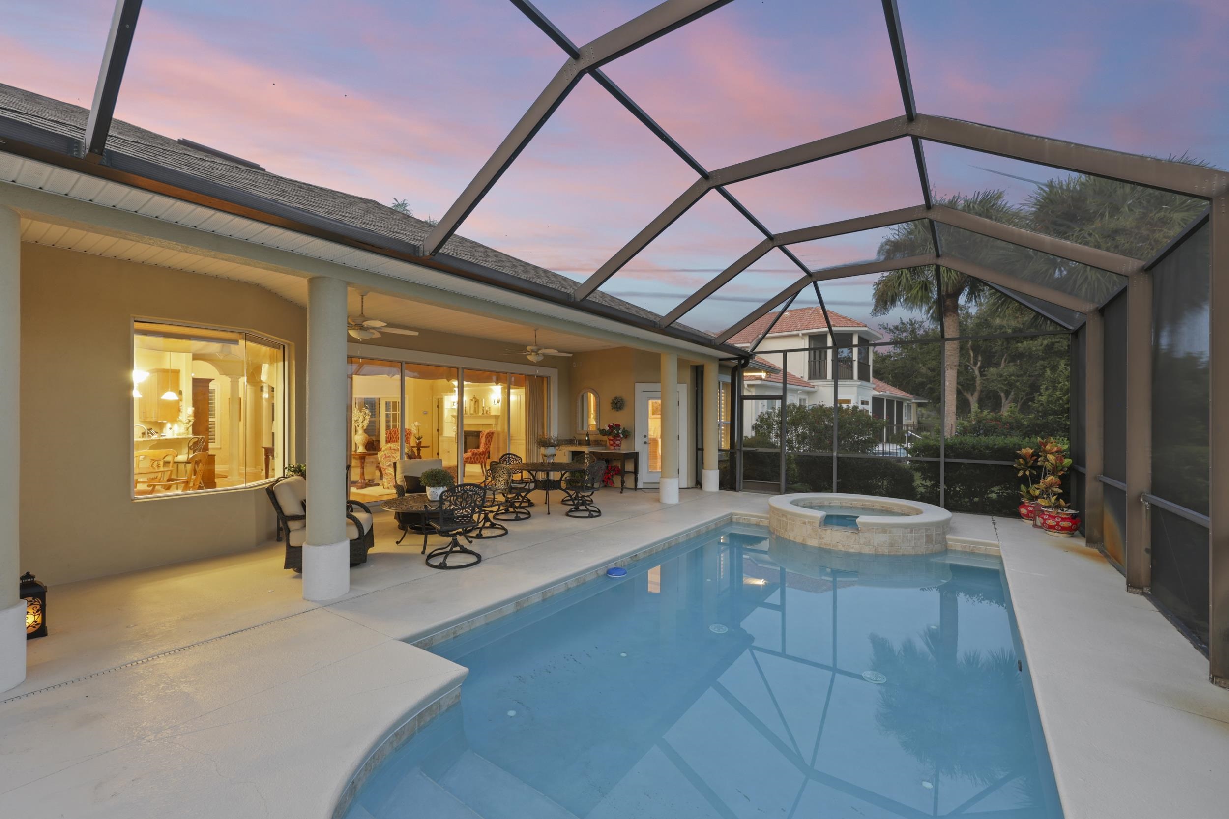 305 Marsh Point Circle St. Augustine, FL 32080 - Photo 61 of 82 View of pool with a sunroom, glass enclosure, ceiling fan, a pool with connected hot tub, and a patio area
