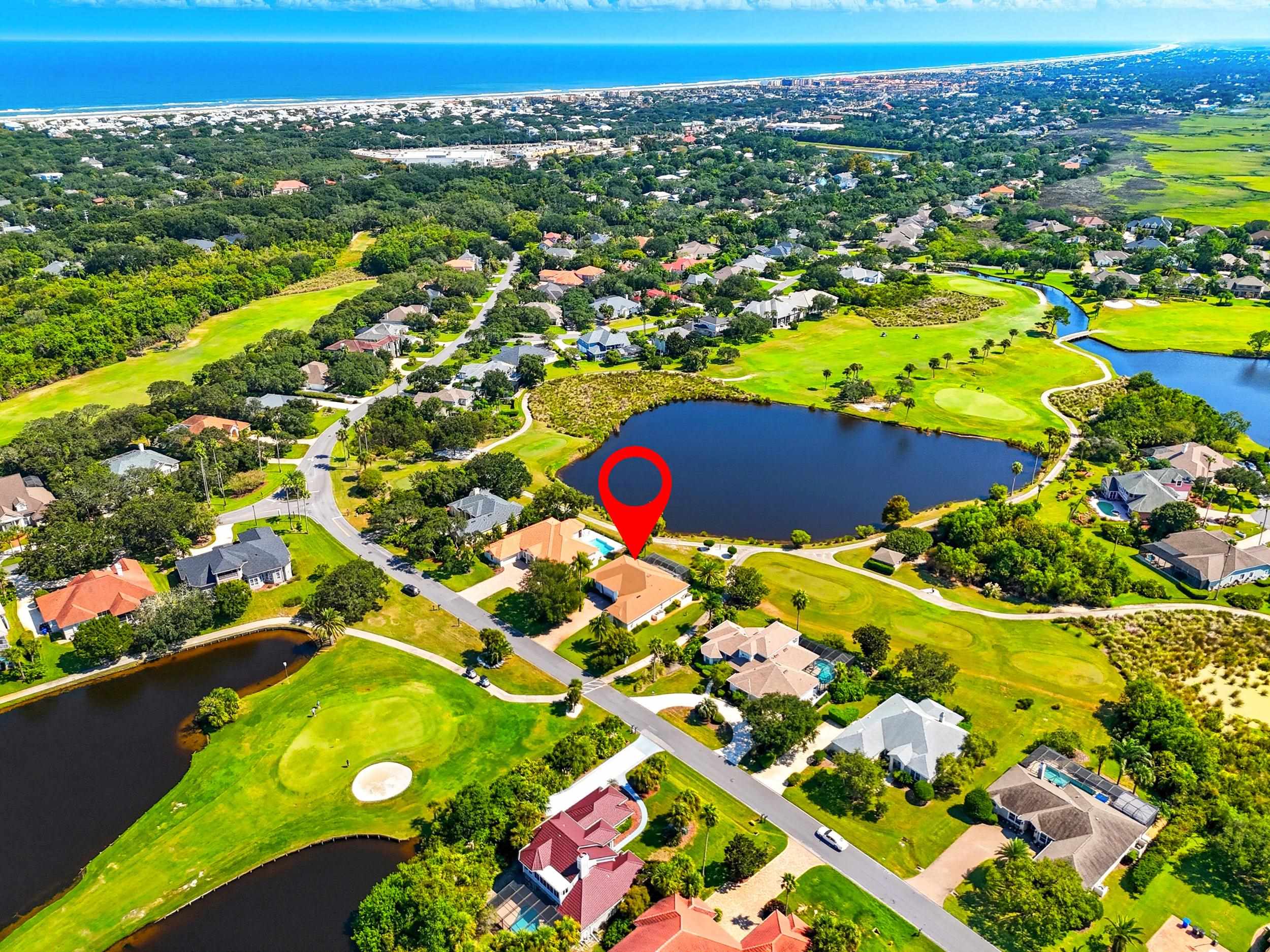 305 Marsh Point Circle St. Augustine, FL 32080 - Photo 68 of 82 Aerial overview of property's location featuring a large body of water, a golf course, and nearby suburban area