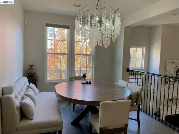a view of a dining room with furniture and window