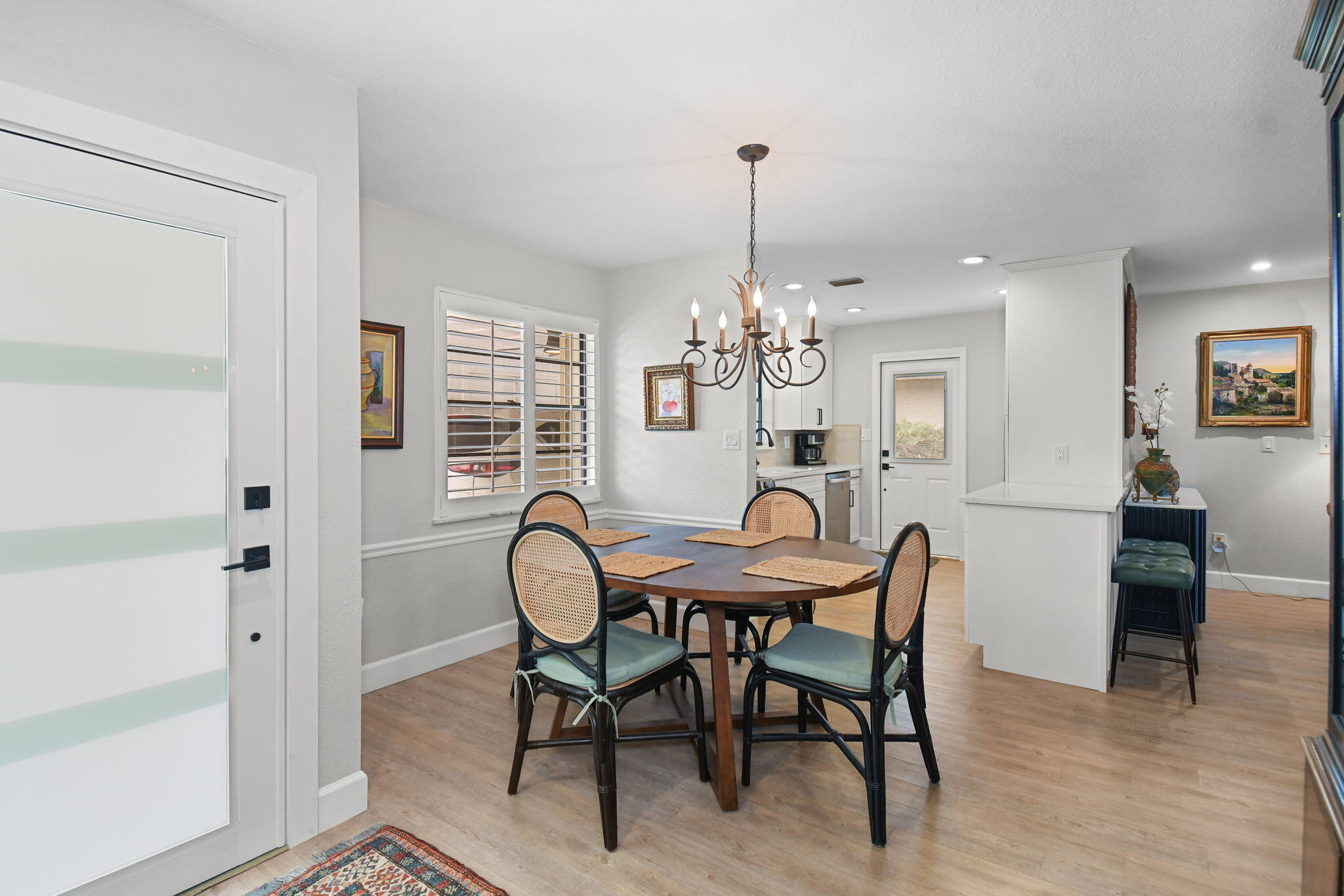 5251 Southeast Sea Island Way Stuart, FL 34997 - Photo 7 of 68 a view of a dining room with furniture window and wooden floor