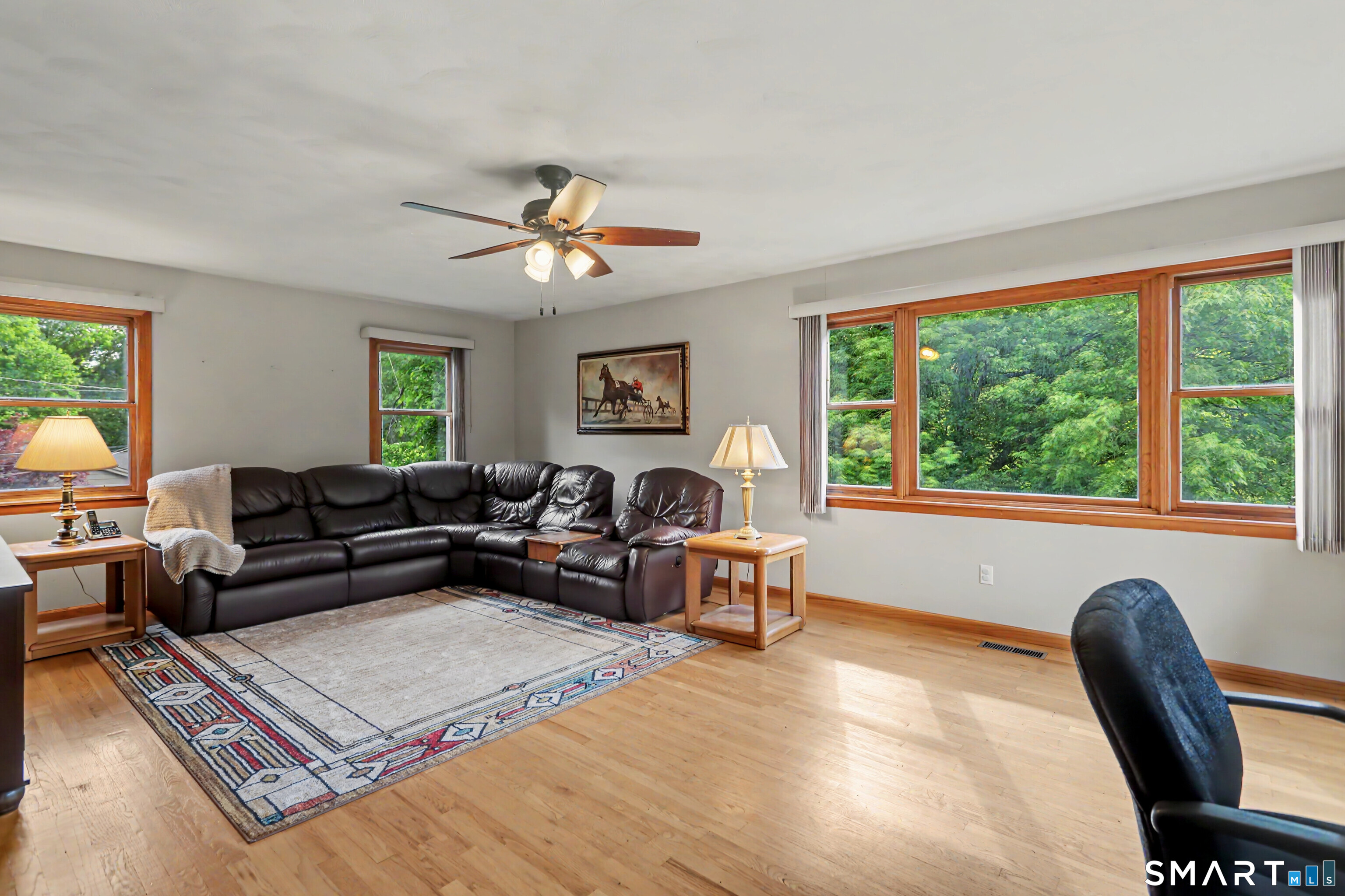 632 Wheelers Farm Road Orange, CT 06477 - Photo 14 of 39 a living room with furniture and a large window