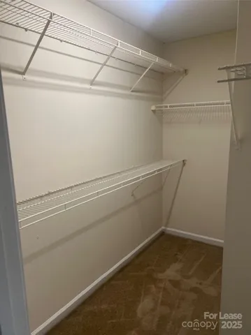 a view of a room with racks on the wall