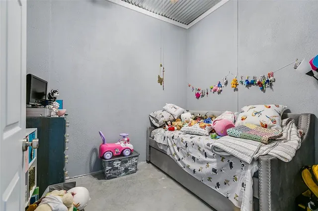 a room with a bed and a window