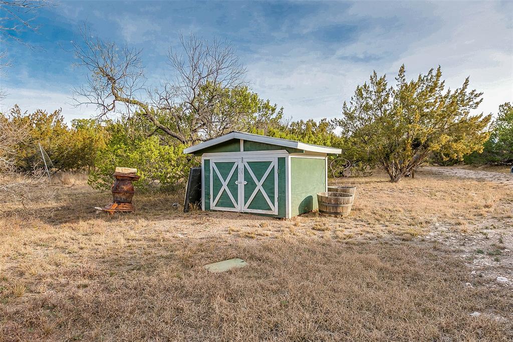 Na Cox Road Robert Lee, TX 76945 - Photo 5 of 40 a front view of a house with a yard and garage