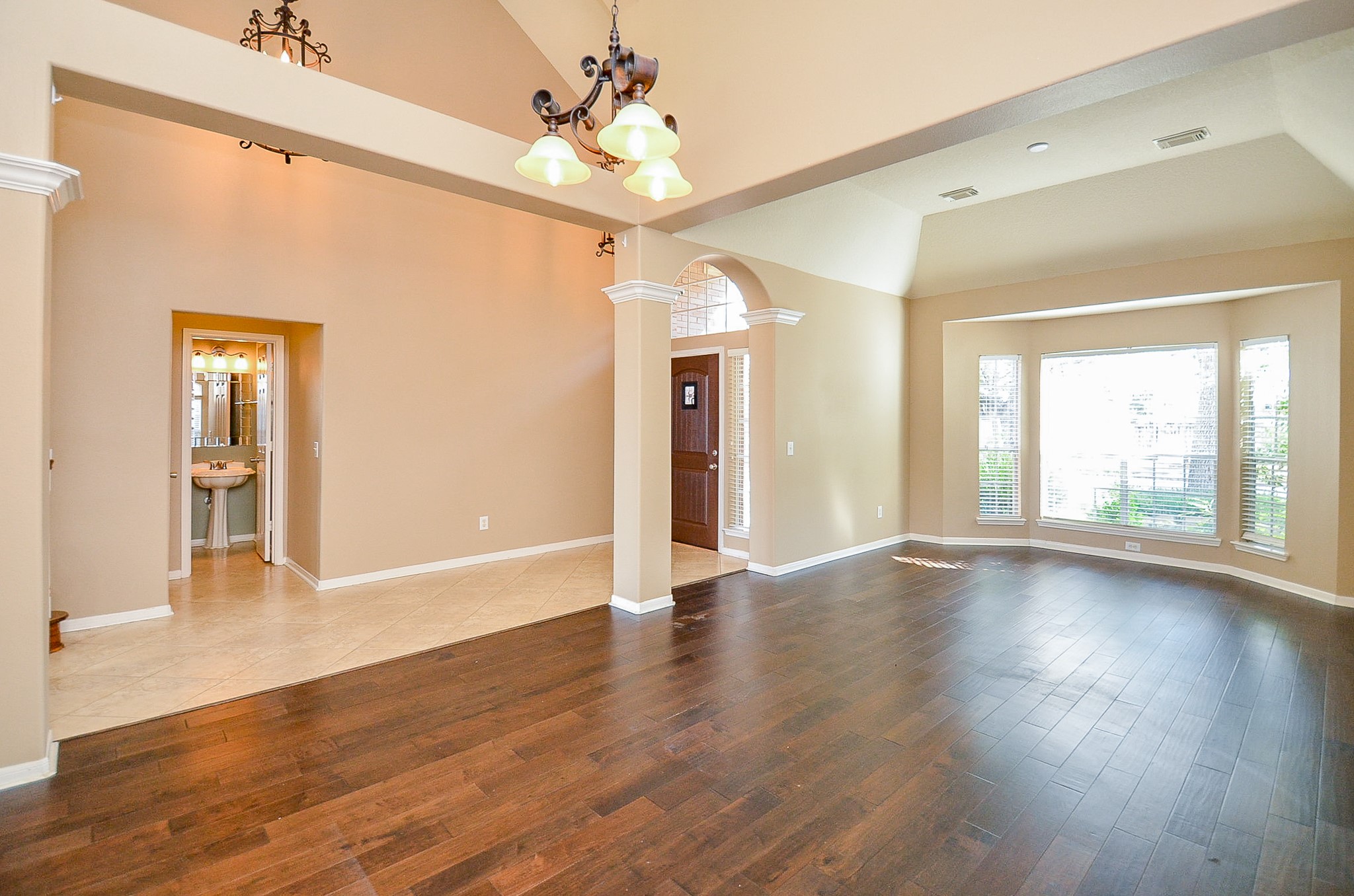 1222 Ragsdale Lane Katy, TX 77494 - Photo 4 of 31 The combined living/dining area has pretty architectural features which add interest to the design. Lovely hardwoods in a warm and inviting color.