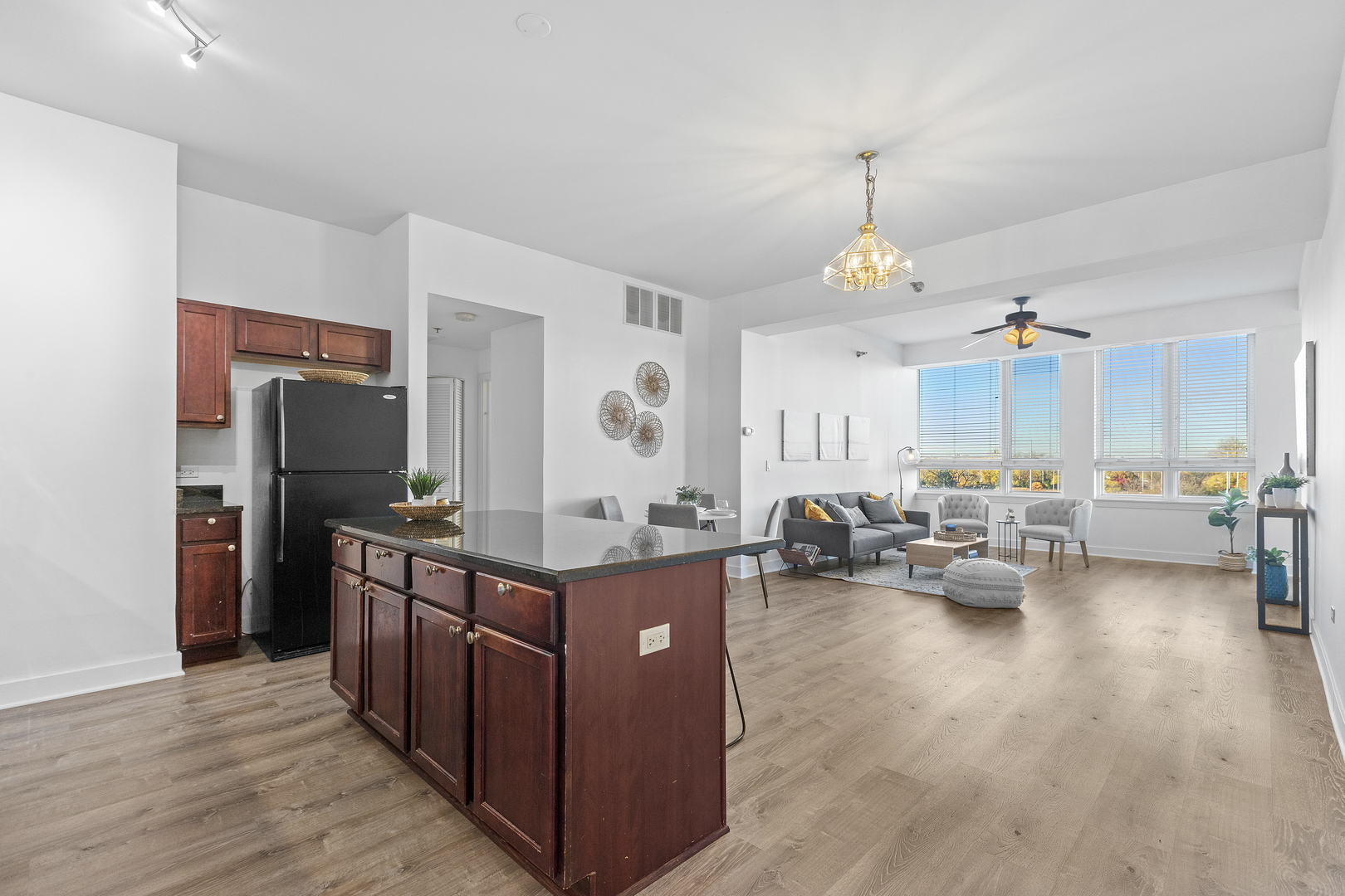 6000 North Cicero Avenue, Unit 404 Chicago, IL 60646 - Photo 2 of 15 a kitchen with stainless steel appliances granite countertop a stove and a wooden floors