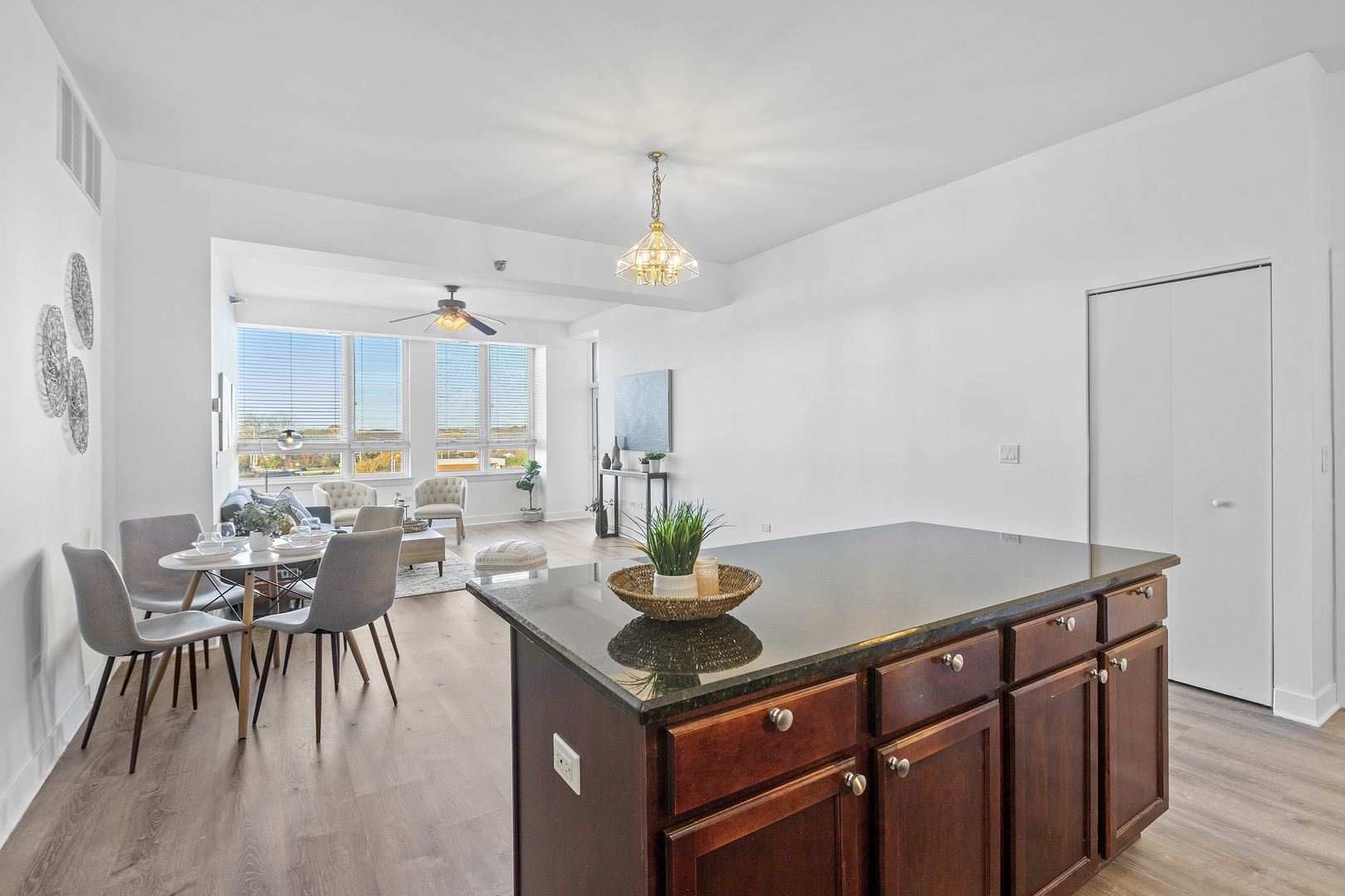 6000 North Cicero Avenue, Unit 404 Chicago, IL 60646 - Photo 4 of 15 a kitchen with a table chairs and white cabinets