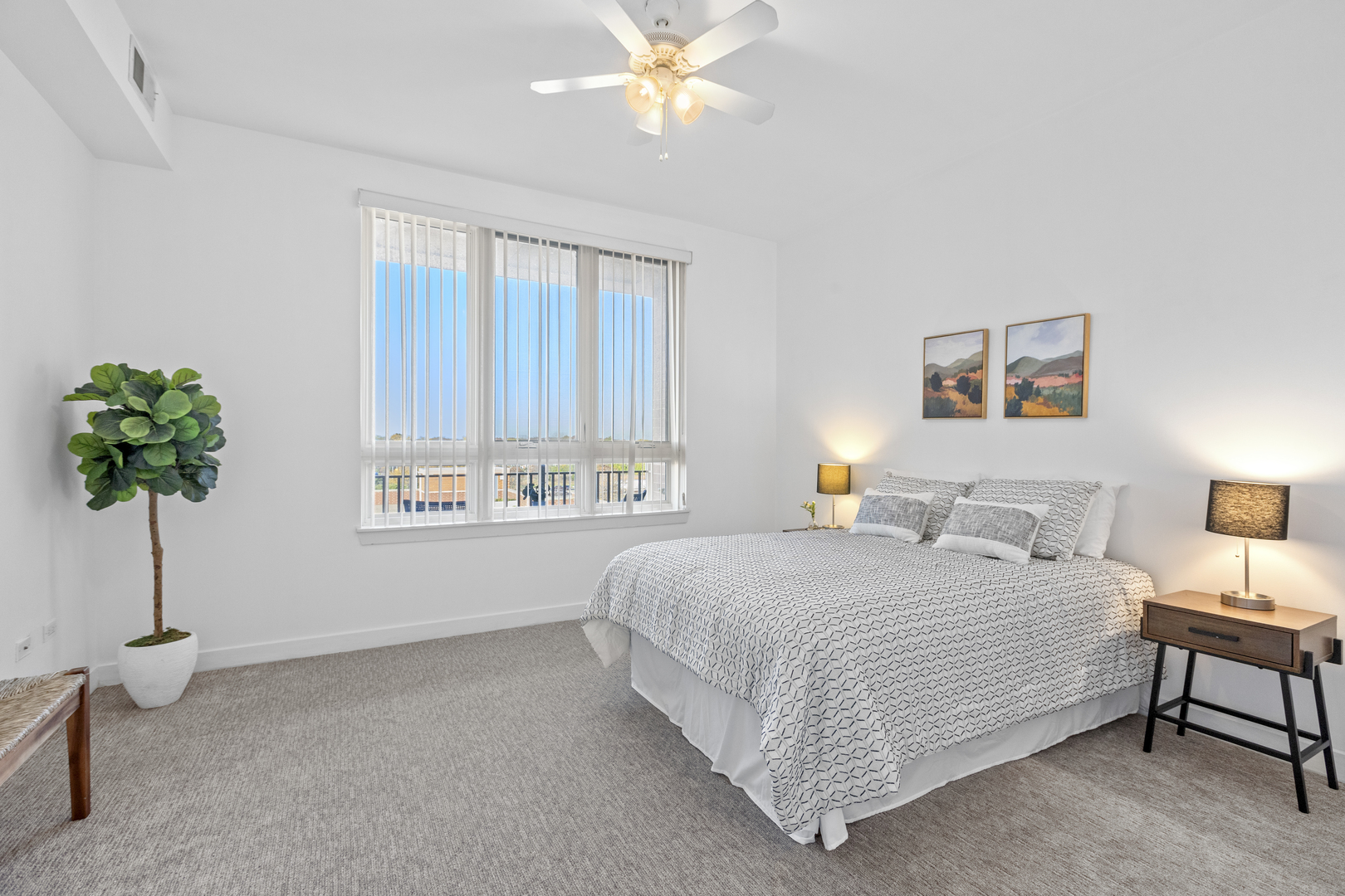 6000 North Cicero Avenue, Unit 404 Chicago, IL 60646 - Photo 7 of 15 a bedroom with a bed and a chandelier
