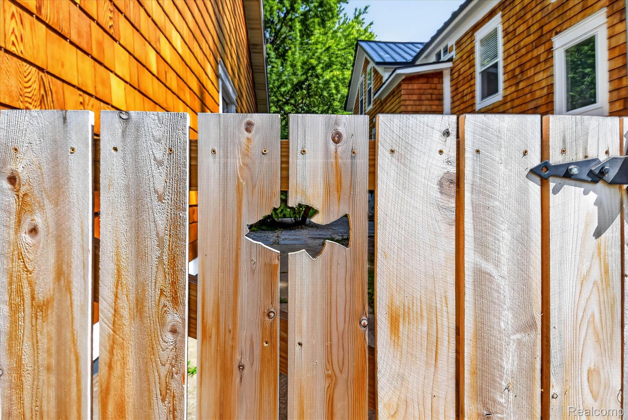 3550 Myrtle Road Fort Gratiot, MI 48059 - Photo 47 of 51 Wood privacy fence with a decorative fish cutout