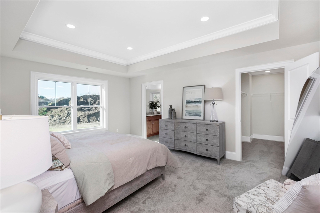 150 County Amherst, NH 03031 - Photo 11 of 26 a bedroom with a bed and a dresser