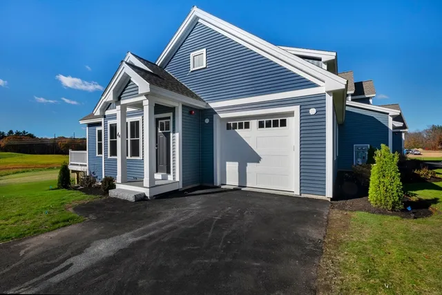a view of a house with backyard