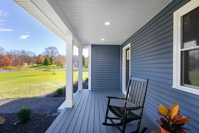 a view of a patio with wooden floor and outdoor seating