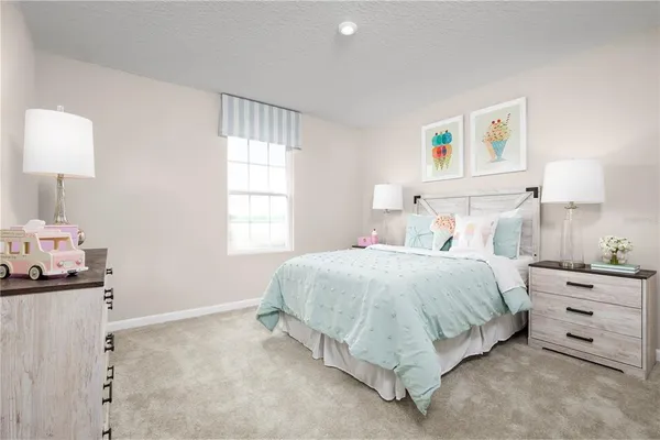 a spacious bedroom with a bed and a window