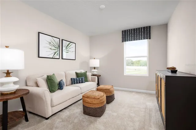 a living room with furniture and a window