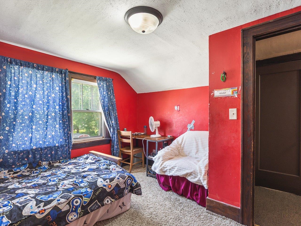 1247 West Logan Street Freeport, IL 61032 - Photo 21 of 34 a bedroom with a bed and window