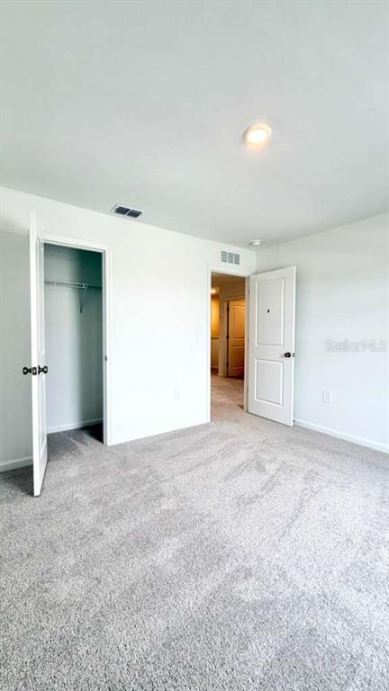 5174 Clay Whaley Road St. Cloud, FL 34772 - Photo 12 of 25 an empty room with a natural light