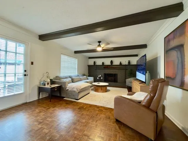 a living room with furniture and a fireplace