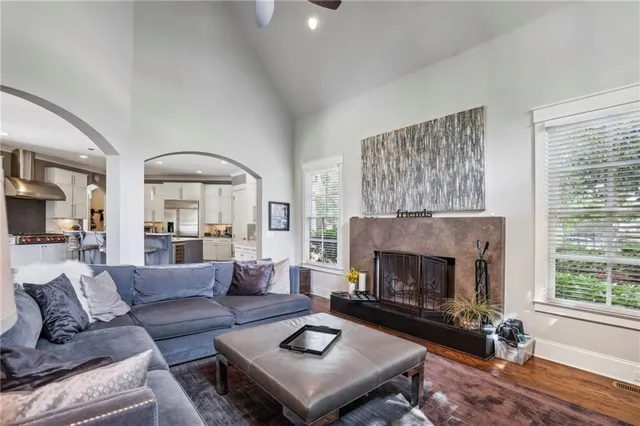 a living room with furniture and a fireplace