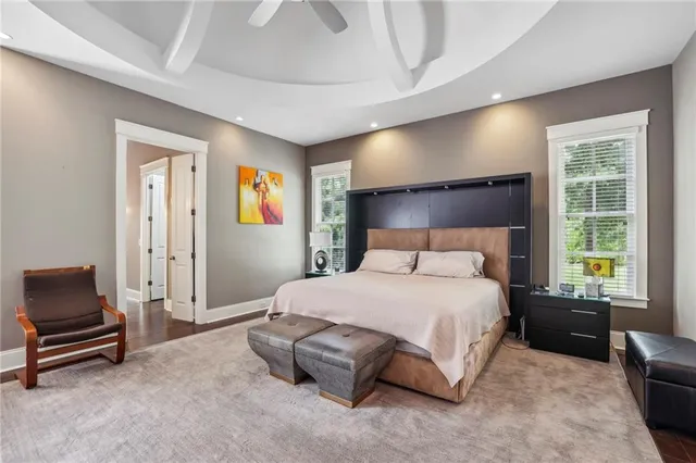 a spacious bedroom with a bed and a couch