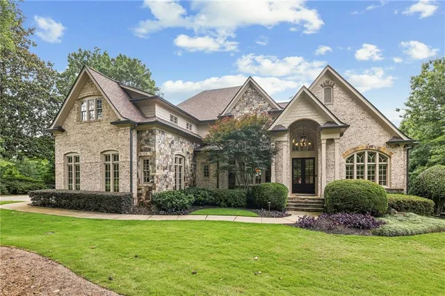 a front view of a house with a yard
