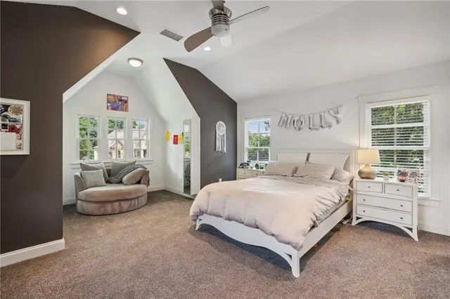 a bedroom with a bed and furniture