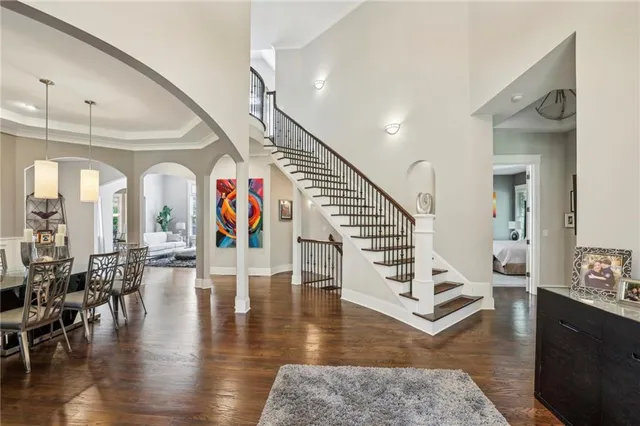 a view of entryway and hall with wooden floor