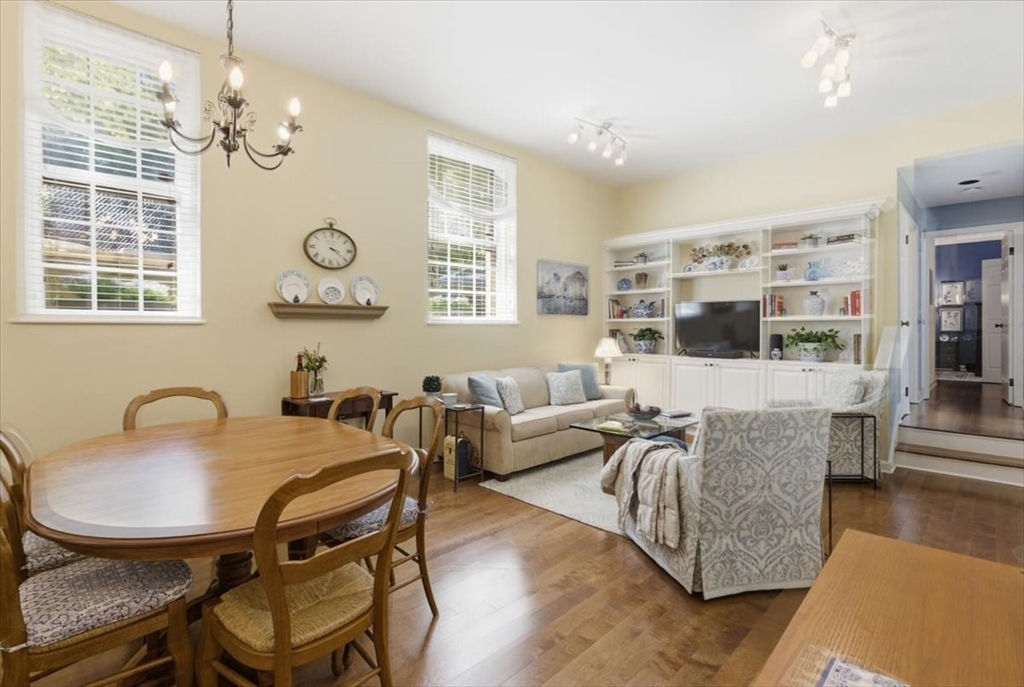 65 Glen Road, Unit H1 Brookline, MA 02445 - Photo 1 of 39 a living room with furniture and a large window