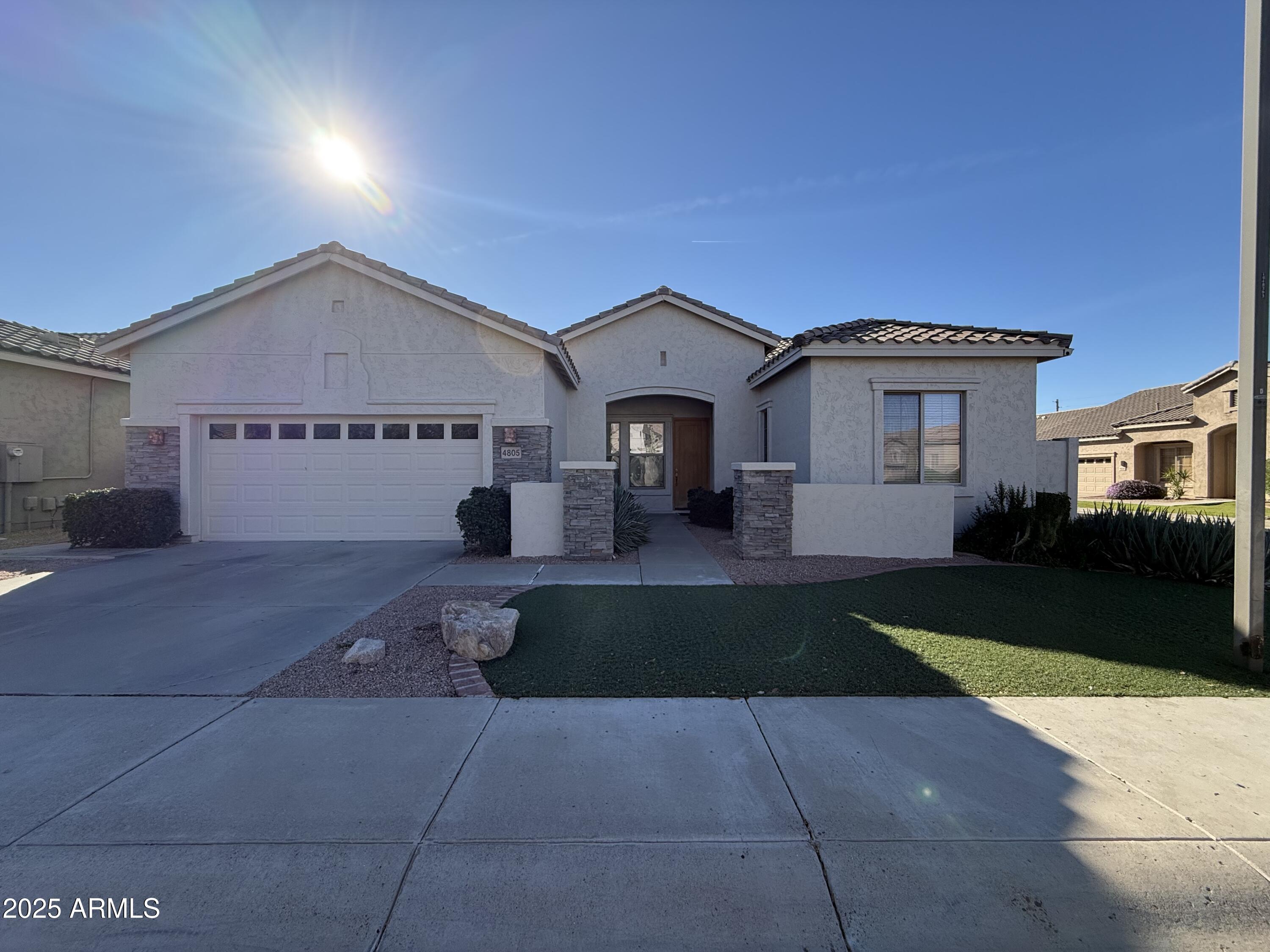 4805 East Wagoner Road Scottsdale, AZ 85254 - Photo 12 of 12 a front view of a house with garden