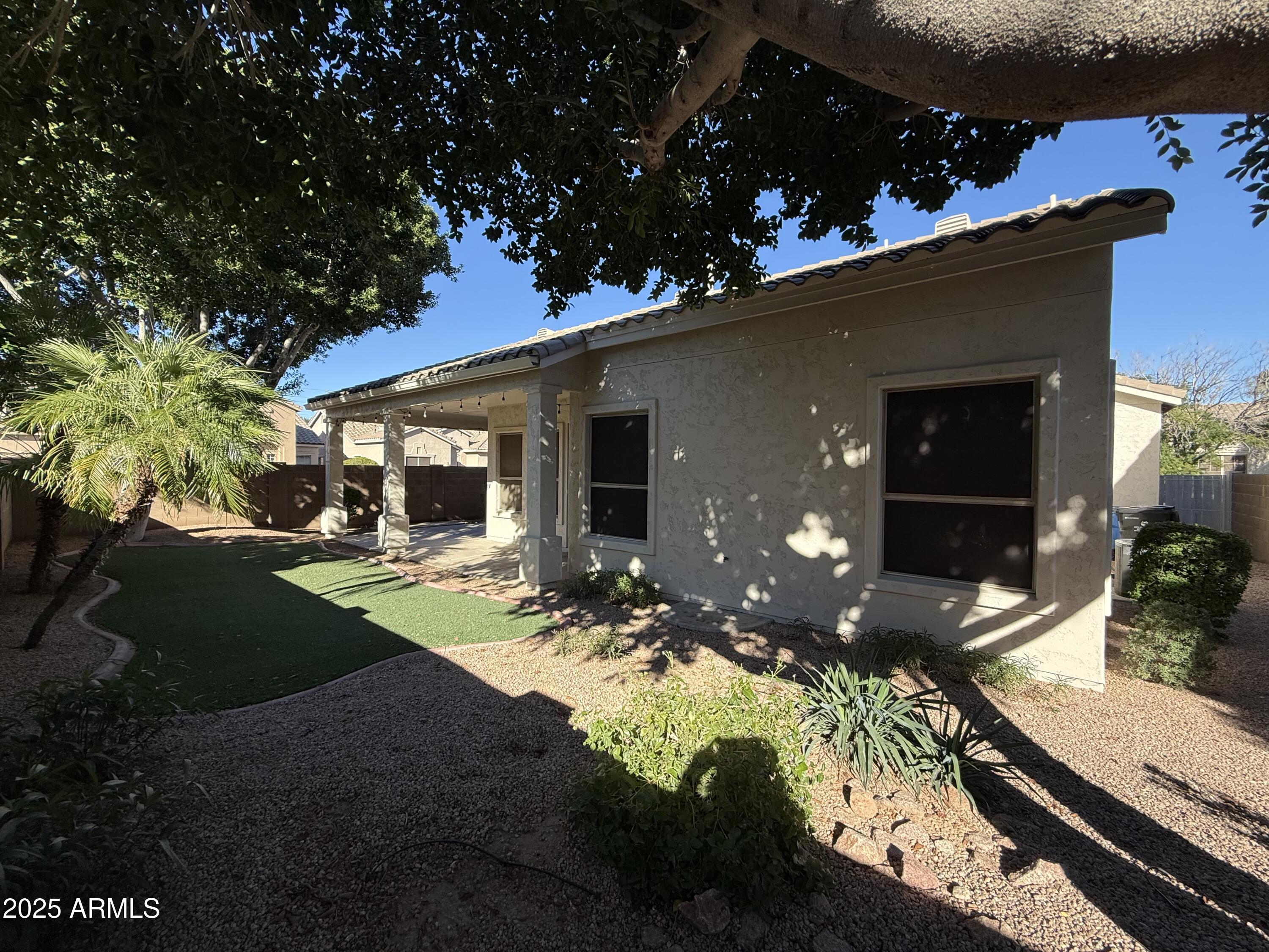 4805 East Wagoner Road Scottsdale, AZ 85254 - Photo 10 of 12 a front view of a house with a yard