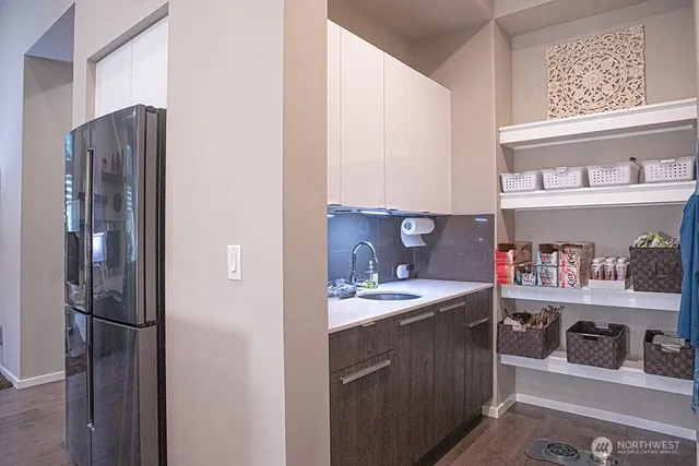a bathroom with a sink vanity mirror and toilet