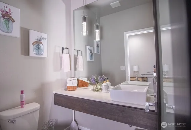 a bedroom with a large bed and a couch