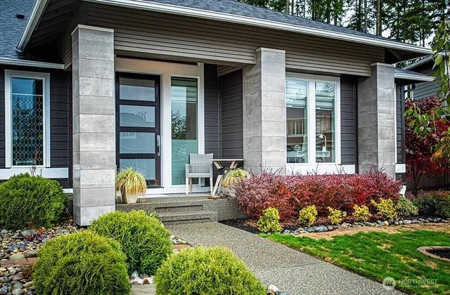 a front view of a house with garden